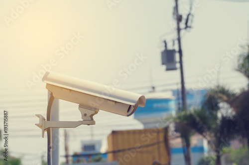 closed circuit television on public park in day time, view from side CCTV.