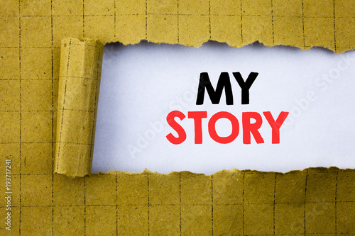 My Story. Business concept for Telling Tell About You written on white paper on the yellow folded paper. photo