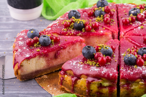 Specialty cheesecake with fresh berries in berry sauce