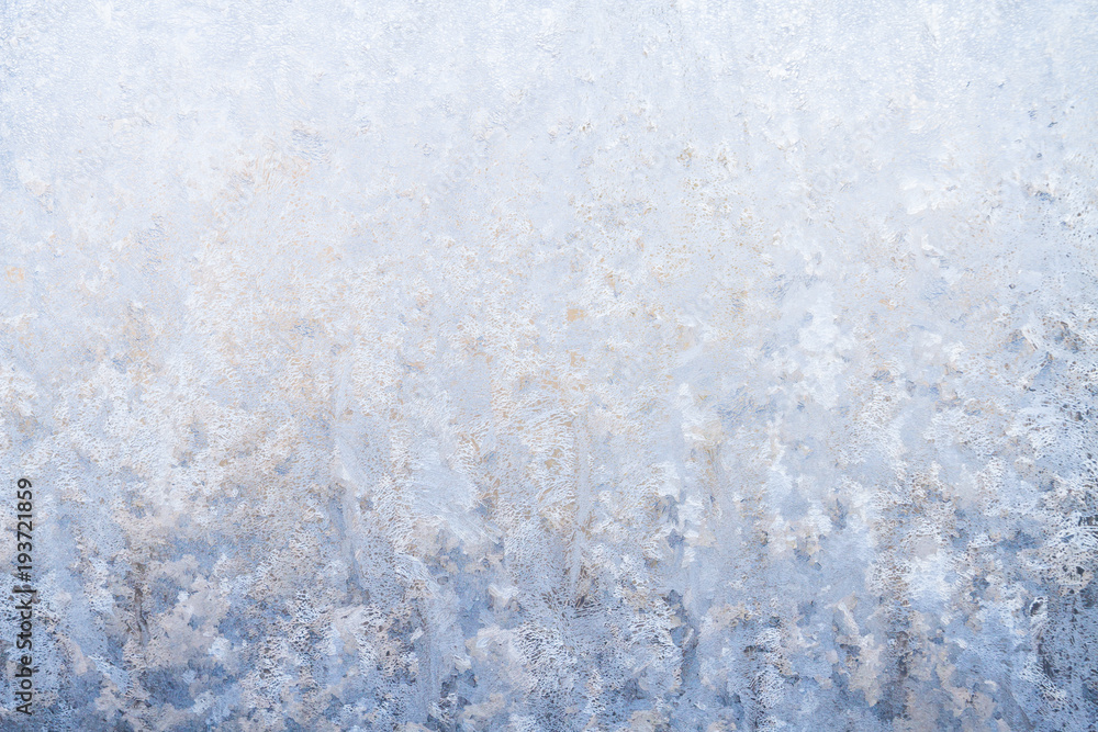 Winter frosty patterns on the frozen ice window Winter frosty patterns on the frozen ice window