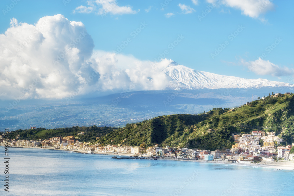 Panoramic view of Giardini Naxos with the Mount Etna. View from Taormina. Province of Messina. Sicily, Italy.