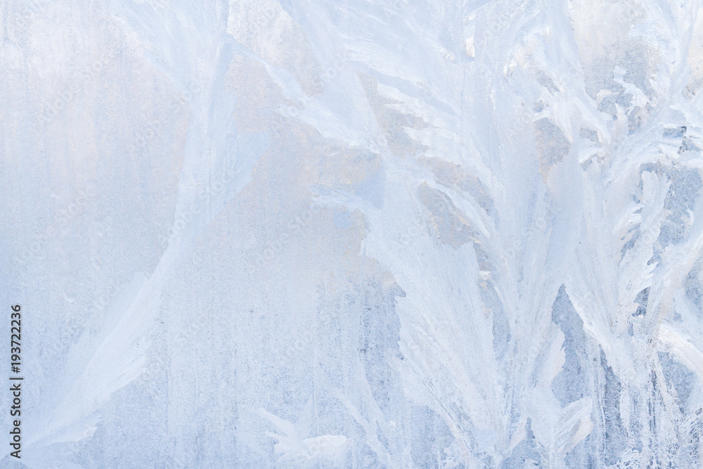 Winter frosty patterns on the frozen ice window Winter frosty patterns on the frozen ice window