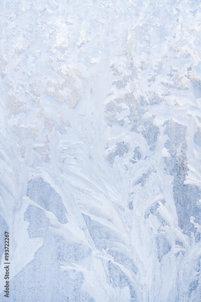 Winter frosty patterns on the frozen ice window Winter frosty patterns on the frozen ice window