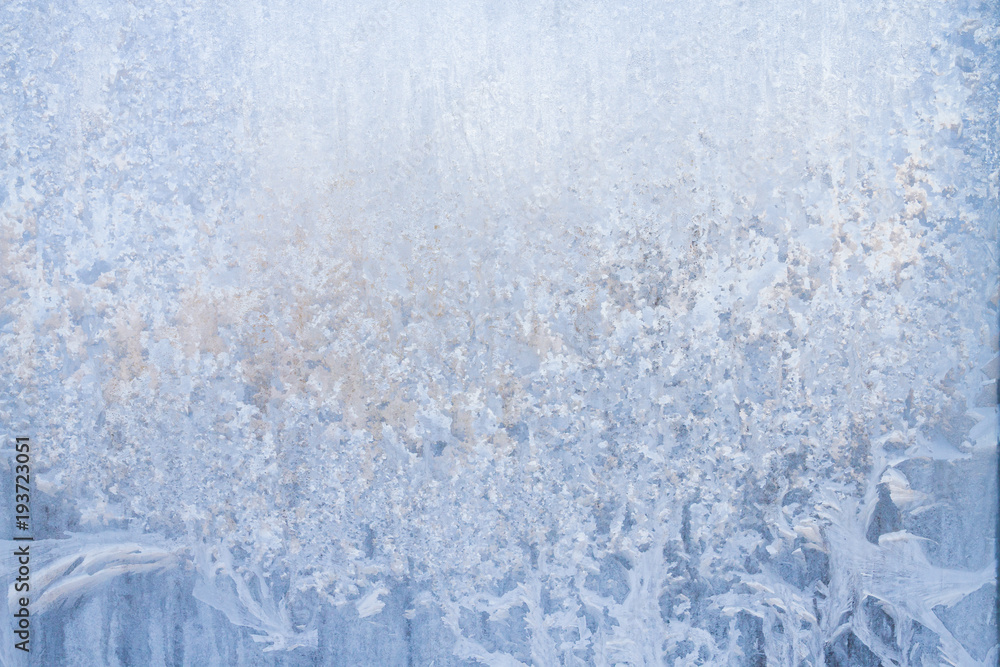 Winter frosty patterns on the frozen ice window Winter frosty patterns on the frozen ice window