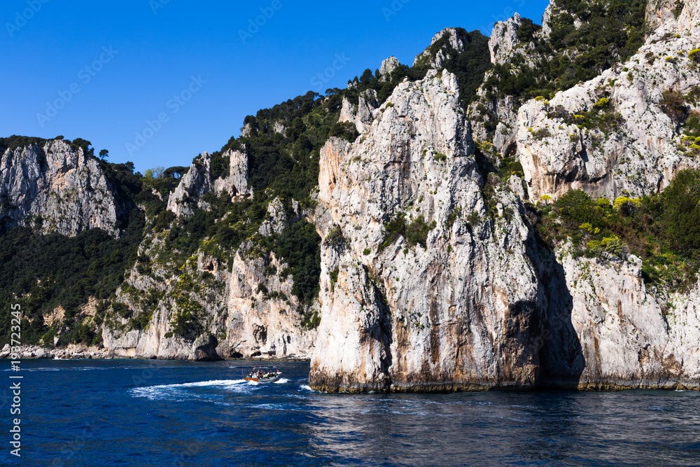Magnificent rocks and cliffs against the background of the sea and the blue sky - natural and travel background