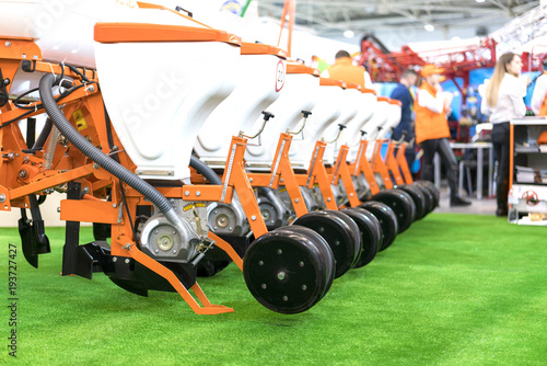 Modern tractor on modern agricultural machinery. photo