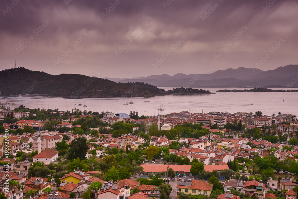 Fethiye, Turkey - May 09, 2017: Landscape of Fethiye city, photo taken from tombs hill during overcast day. Turkey resort. Editorial photo