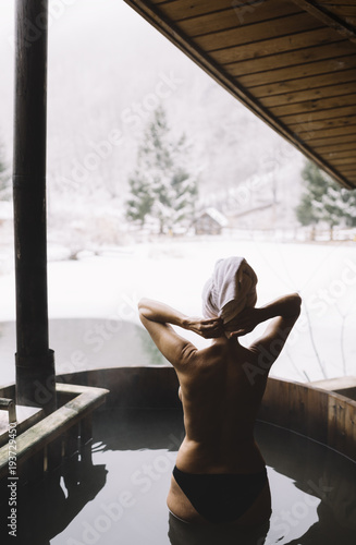 Woman relaxing in hot spring