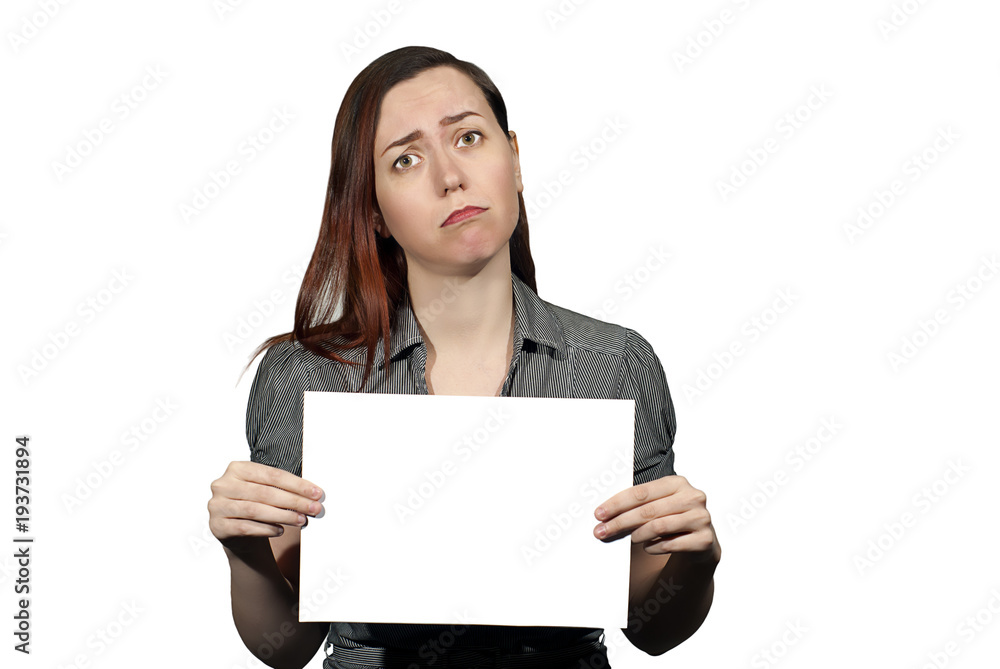 sad young woman on a white background holds a white blank banner with copyspace sad young woman on a white background holds a white blank banner with copyspace