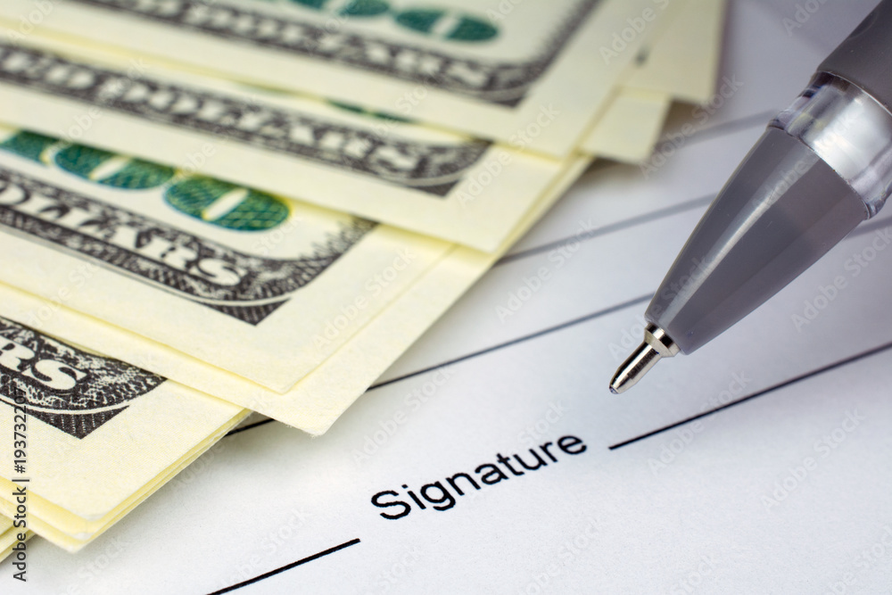 put a signature on an contract waiting to be signed money dollars put a signature on an contract waiting to be signed money dollars