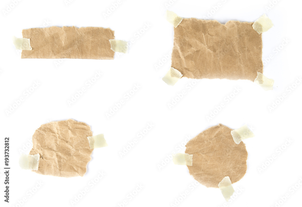 Pieces of  torn note paper sheets with  adhesive sticky tape stuck