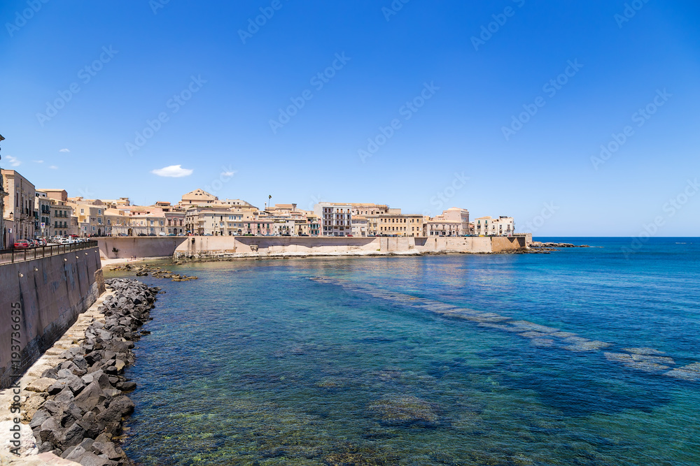 Syracuse, Italy. A picturesque old quay on the island of Ortygia in sunny weather