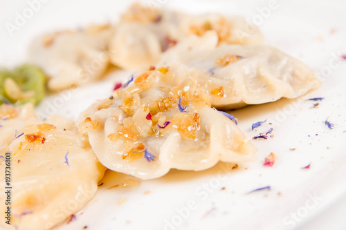 Dumplings with different kinds of stuffing decorated on a plate