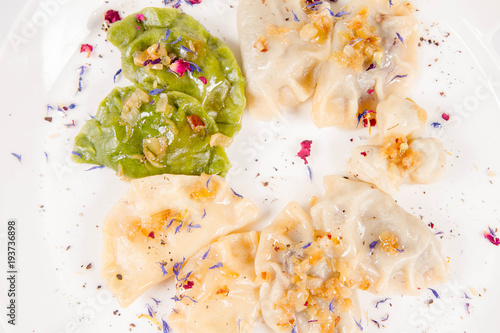 Dumplings with different kinds of stuffing decorated on a plate