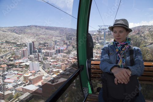 Young woman tourist in La Paz Teleferico Cable car, Bolivia