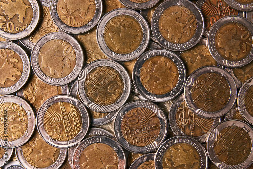 Azerbaijan currency qepik top view. Pile of 50 qepik coins as background, view from above, close-up Azerbaijan currency qepik top view. Pile of 50 qepik coins as background, view from above, close-up