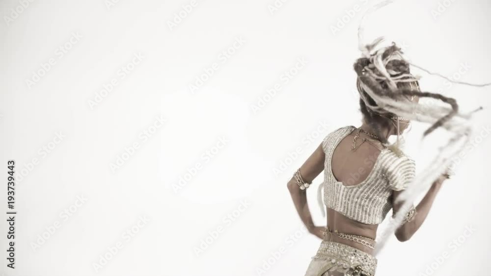 Oriental beautiful girl dancing on a white background Oriental beautiful girl dancing on a white background