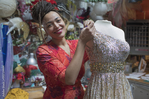 Portrait of smiling young female designer at studio