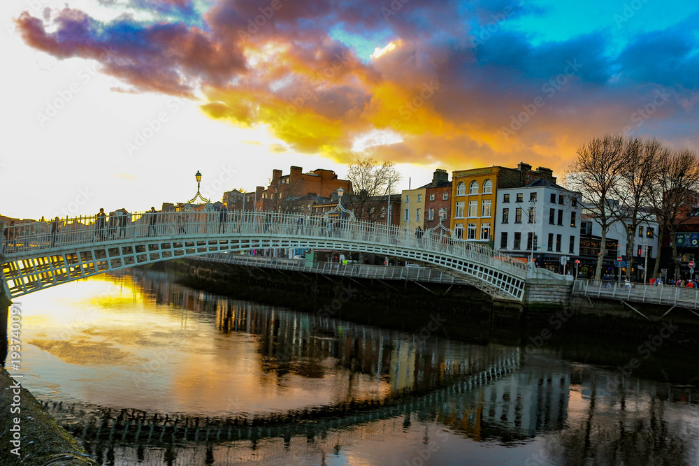 Dublin night scene with Ha'penny bridge and Liffey river lights