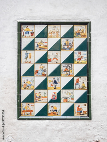 Antique mosaic tiles with different crafts painted on it