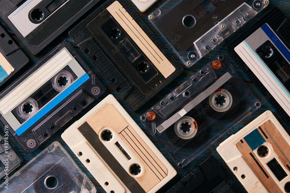 Obraz premium Vintage cassette tape background, top view. Retro audio cassettes collection, close-up