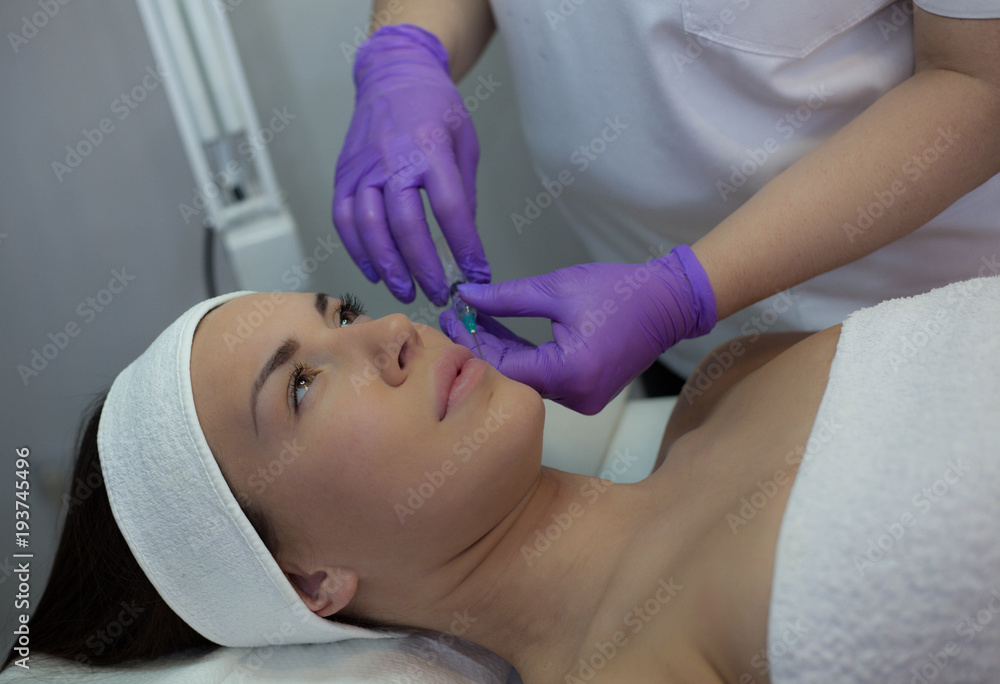Young woman  getting cosmetic procedure.