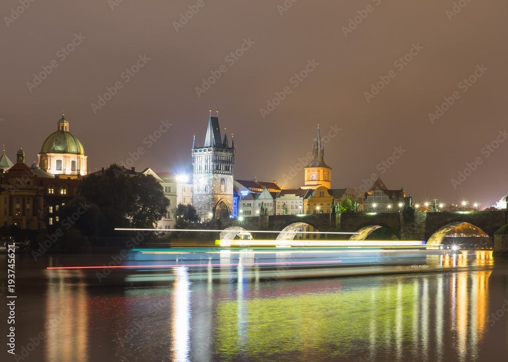  Light trails from boats walking along the Vltava river.  Prague, Czech Republic.