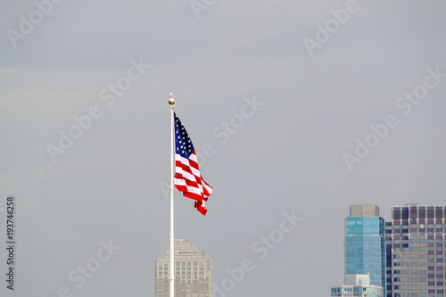 American flag on sky background.