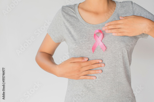 Wallpaper Mural womaen holding pink ribbon breast cancer awareness. concept healthcare and medicine Torontodigital.ca