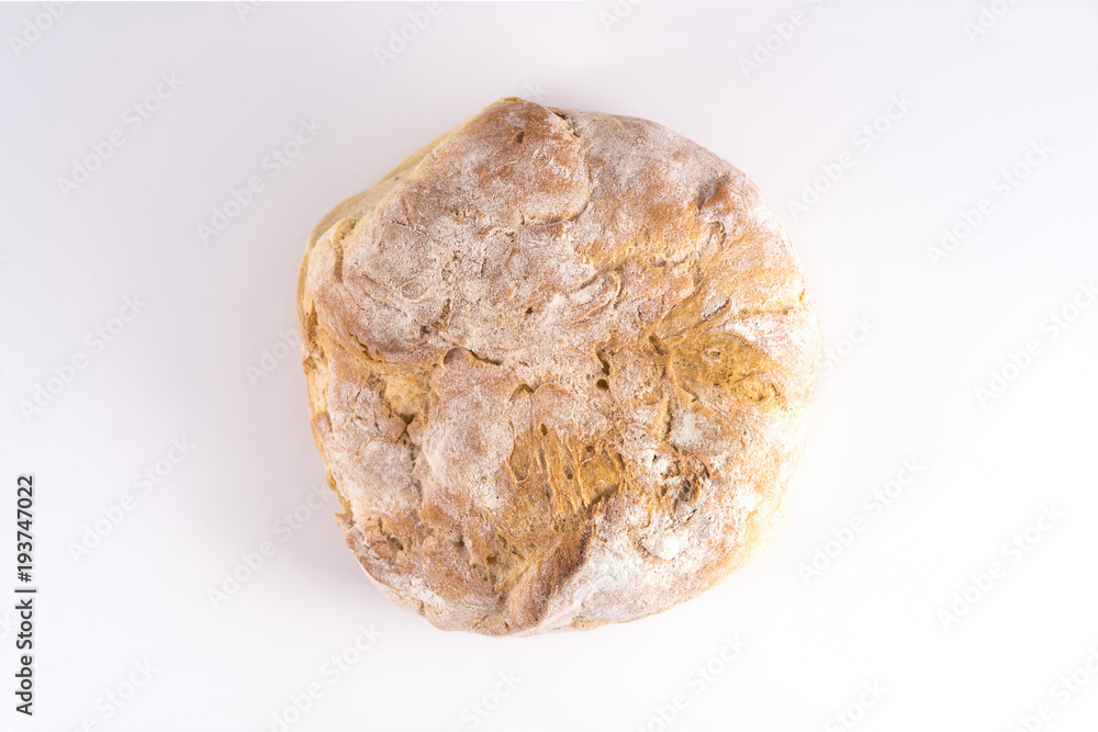 a loaf of bread on a white surface a loaf of bread on a white surface