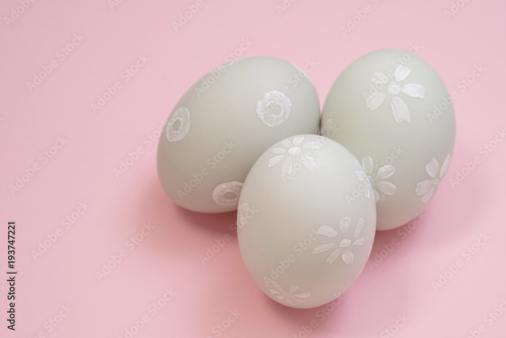 handmade easter eggs isolated on a pink background.
