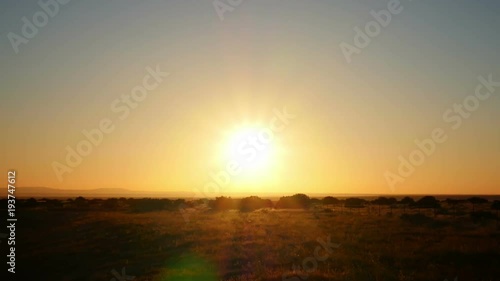 Bright Sun over Field Time Lapse photo