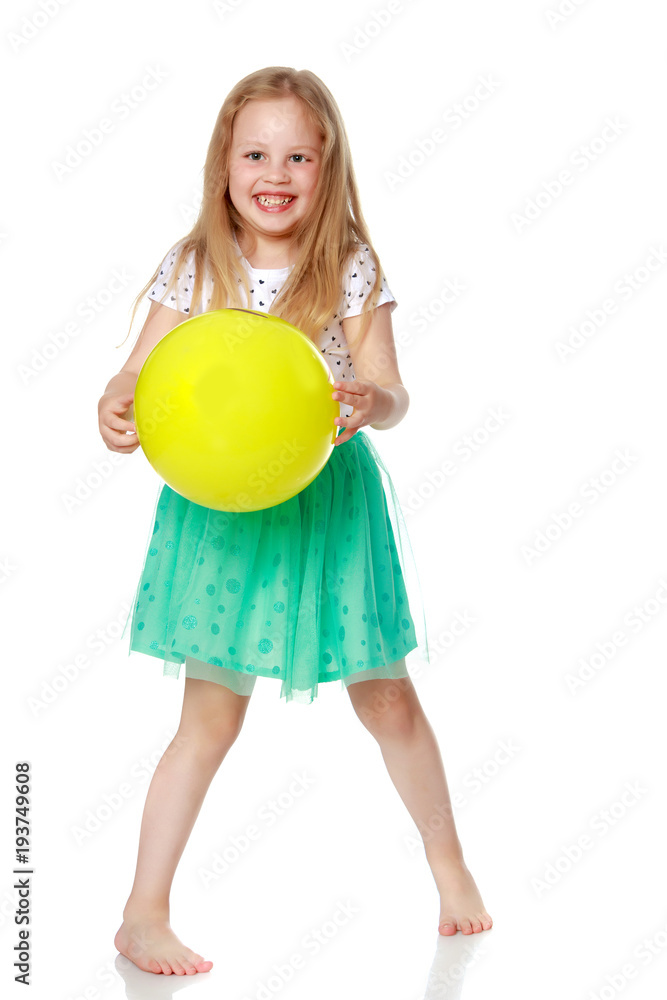 Little girl is playing with a ball Little girl is playing with a ball