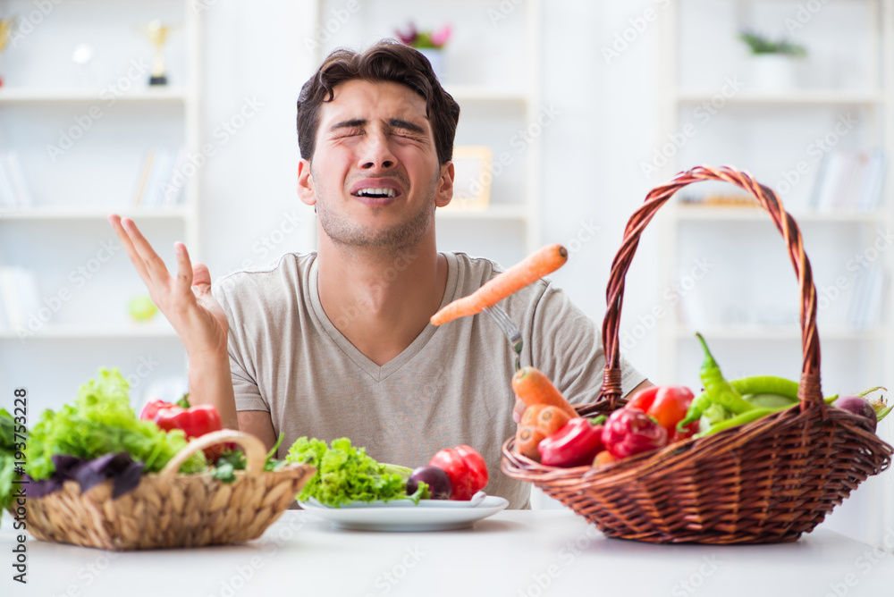 Young man in healthy eating and dieting concept Young man in healthy eating and dieting concept