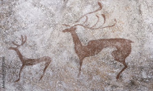 image of deer on the wall of the cave made with ocher. ancient people. hunting. archeology.