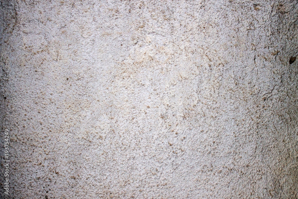 Cement plastered wall. A crack in the wall. Cement plastered wall. A crack in the wall.