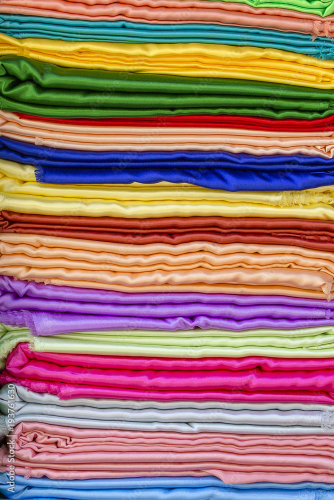 Heap of cloth fabrics at a outdoor street market in India Heap of cloth fabrics at a outdoor street market in India