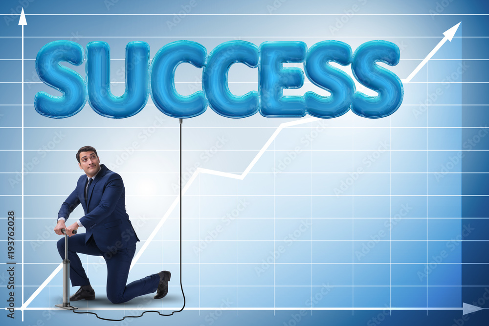 Businessman pumping his success with air balloon Businessman pumping his success with air balloon