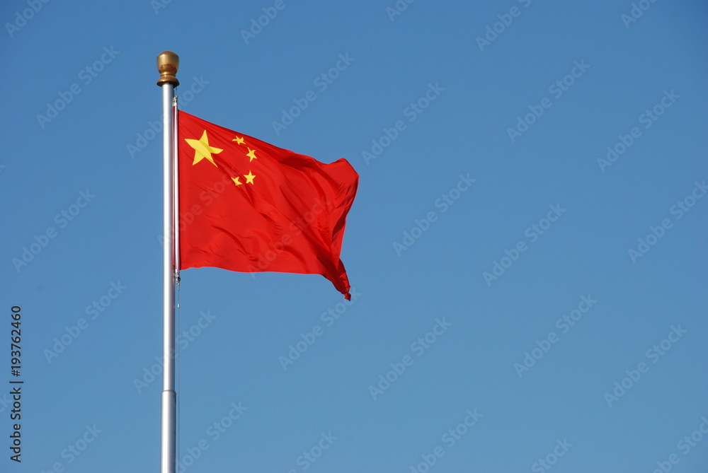 Chinese flag waving in the wind with clear blue sky Chinese flag waving in the wind with clear blue sky