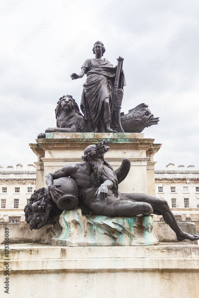 Neoclassical Somerset House in the district Covent Garden, King George III statue on courtyard, London, United Kingdom