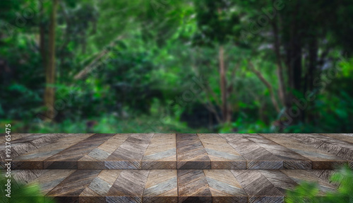 Empty step grunge wood table top with blur tree in tropical forest with bokeh light at background,Mock up template for display of your design,Banner for advertise of product,panorama view