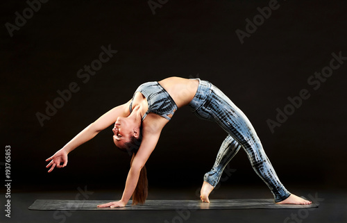 Fit supple young woman doing a wild thing pose