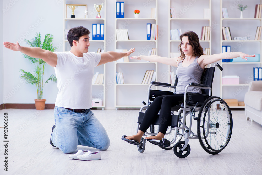 Patient undergoing rehabilitation recovery programme with doctor Patient undergoing rehabilitation recovery programme with doctor