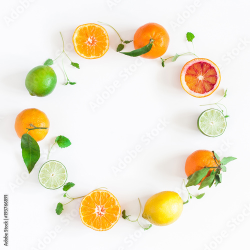 Fruit background. Colorful fresh fruits on white table. Orange, tangerine, lime, lemon, grapefruit. Flat lay, top view, copy space, square