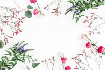 Flowers composition. Frame made of various colorful flowers on white background. Flat lay, top view, copy space