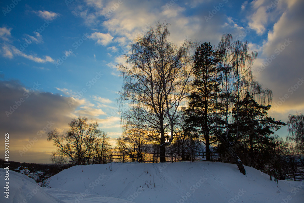 Winter sunset over an old graveyard