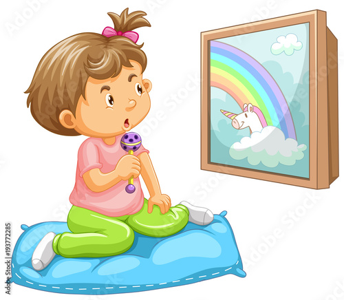 Girl toddler looking at unicorn