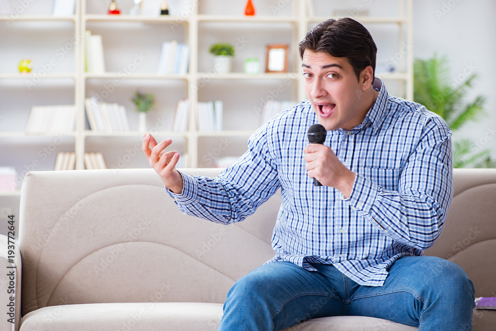 Funny man singing songs in karaoke at home Funny man singing songs in karaoke at home
