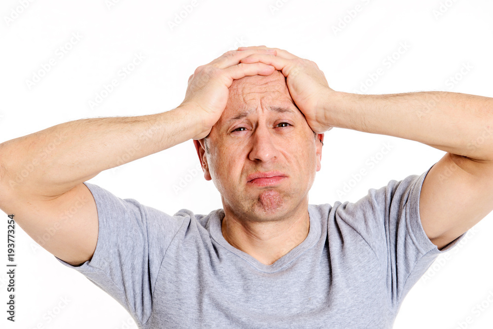 man with hands on head looking shocked man with hands on head looking shocked