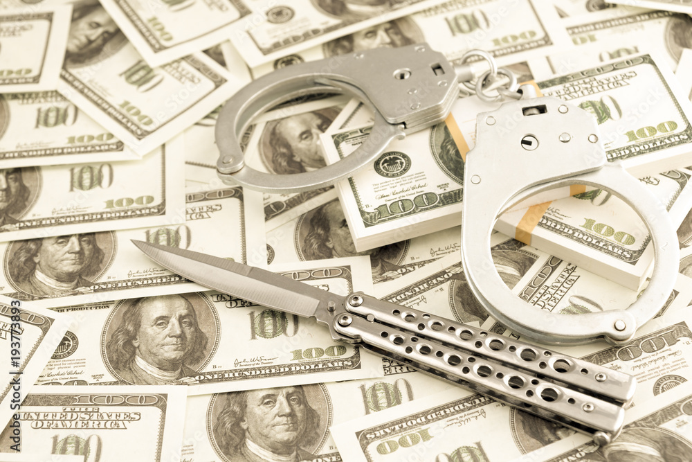 knife, handcuffs, dollars. robbery. violation of criminal law knife, handcuffs, dollars. robbery. violation of criminal law